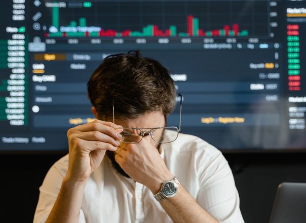 Cryptocurrency Downward Trend: Sad Man after Big Loss of Bitcoin