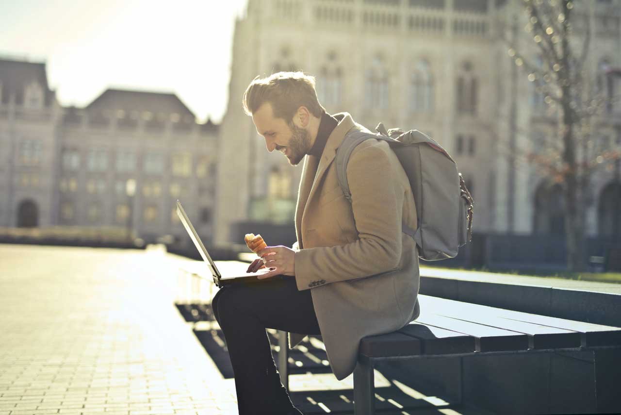 Best Jobs for Digital Nomads: Picture of a Guy Working Outside